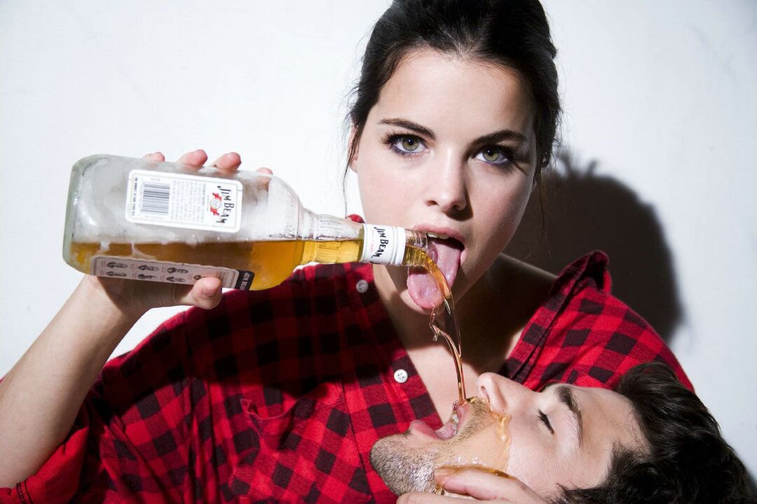 The girl poured wine on the man before having sex